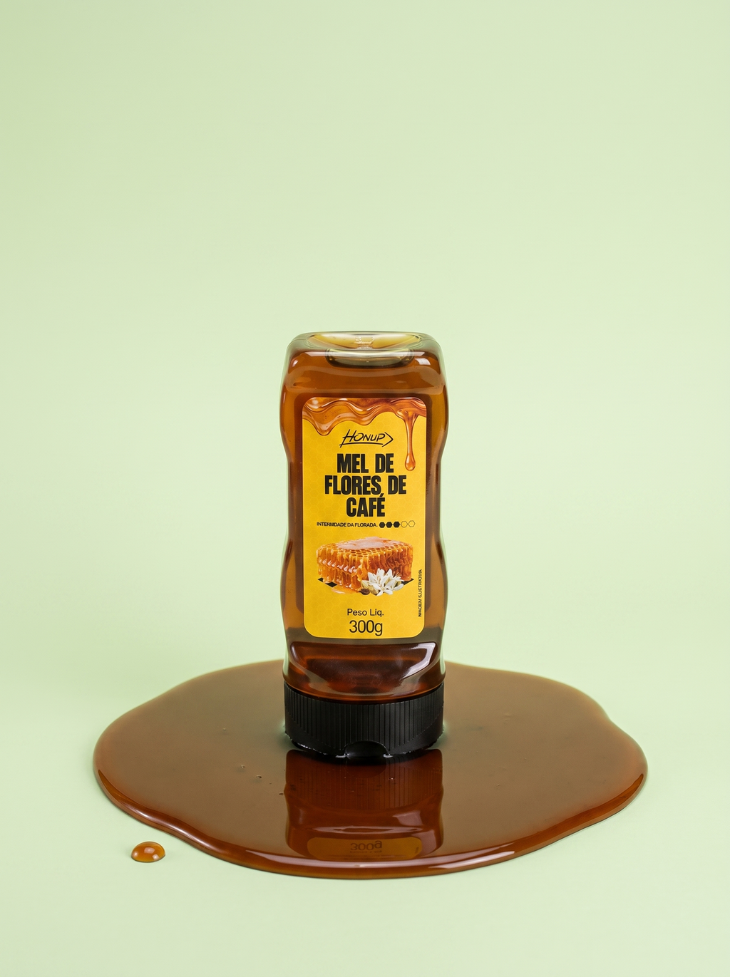 Bisnaga de Mel de Flores de Café Honup 300g sobre fundo verde claro