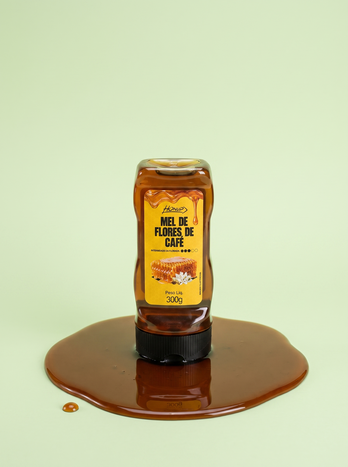 Bisnaga de Mel de Flores de Café Honup 300g sobre fundo verde claro
